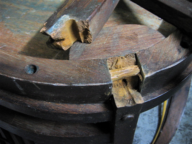 antique bench, rotted wooden leg